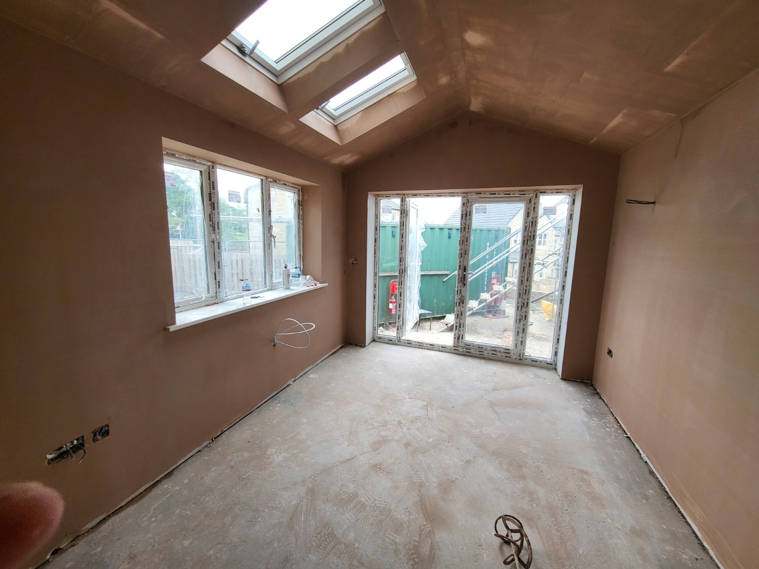 Fresh plastered room with bifold doors