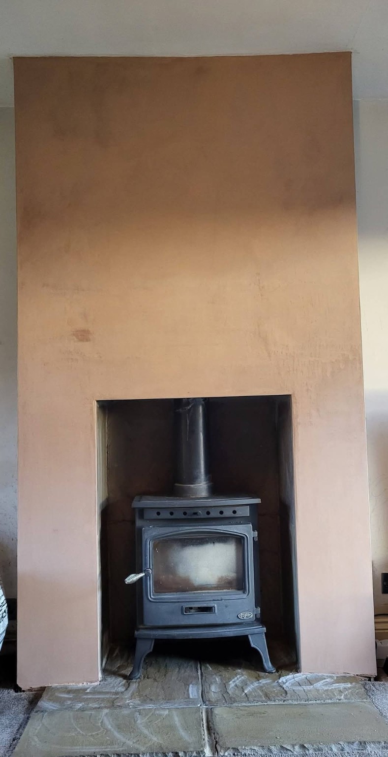 Finished plastered fireplace surround